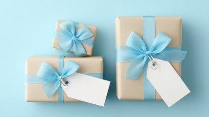 Stacked gift boxes with light blue ribbons and tags