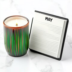 Candle lighting and monthly planning home office decorative objects cozy atmosphere close-up view mindfulness concept