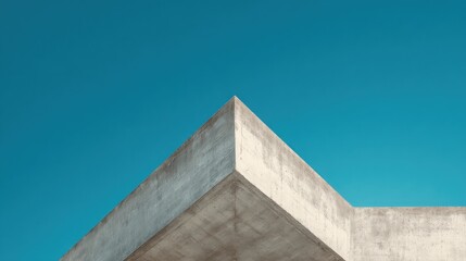 Abstract concrete architectural detail against a vibrant blue sky
