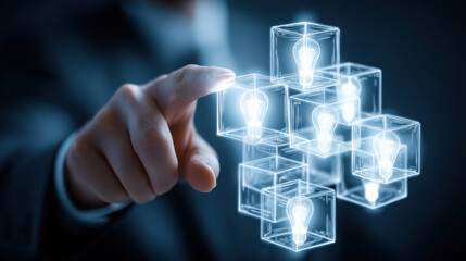 Futuristic technology concept with hand interacting with glowing light bulb cubes, symbolizing innovation and creativity in business and ideas. image conveys sense of inspiration and progress