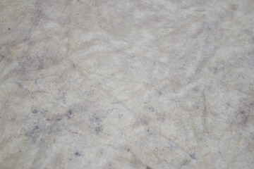 Close up texture of old dirty fabric with stains and wrinkles, concept of grunge background, rough surface, and worn material detail.
