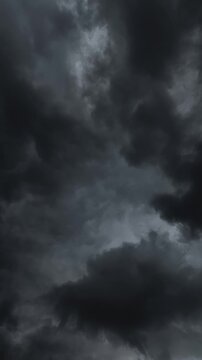 Dark stormy rain cloud formations move quickly overhead TIMELAPSE