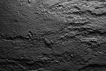 Dark, textured stone surface