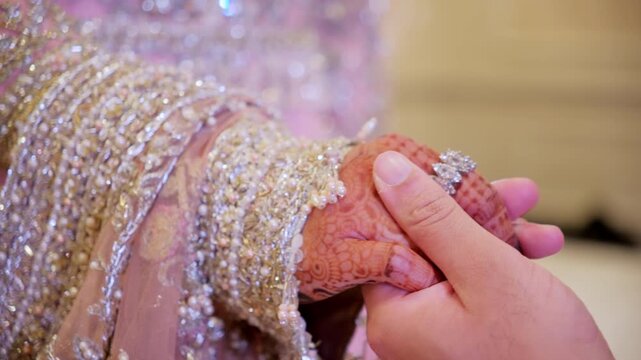 Asian bride and groom holding Hands during Wedding Photoshoot 