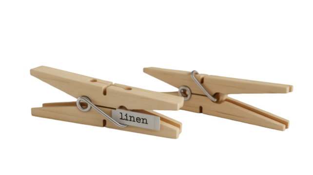 Two Wooden Clothespins with "Linen" Label