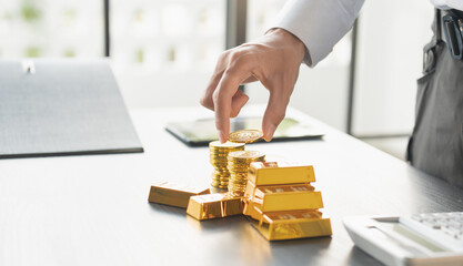 Gold Trading business man hand offering gold Investment in gold mining company or Trading gold on the stock exchange Rising gold prices.