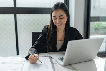 Beautiful&nbsp;confident asian business woman working with laptop Hands typing  keyboard. Professional investor working new start up project. business planning in office. Technology business