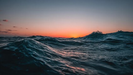 Fototapeta premium Majestic ocean waves at sunset.