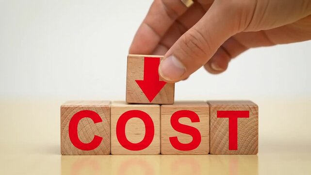 Hand Placing Cost Down Arrow Block on Wood Blocks for Savings Concept