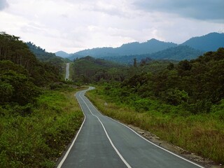The alternative road connecting Batulicin-Banjarbaru was built among the majestic expanse of the Meratus Mountains.