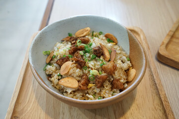 Close up bowl of Japanese garlic rice with crispy beef bits