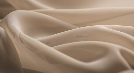 Obraz premium A close-up photograph showcasing the delicate and soft folds of a sheer, beige fabric, conveying a sense of elegance and subtle beauty through its light and shadow interplay and fluid texture