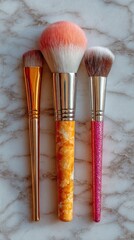 Three makeup brushes with various colors