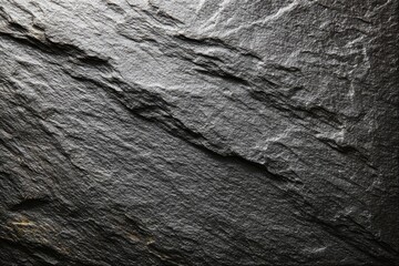 Dark gray stone surface with layered texture
