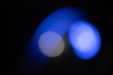 abstract light blue background,retro film overlay effect with colorful blur light leaks, retro grain noisy film distressed flare Spotlight on black background, abstract colorful gradient background