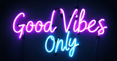 Bright pink neon sign displays Good Vibes Only against dark background. Simple, modern lettering creates positive atmosphere.