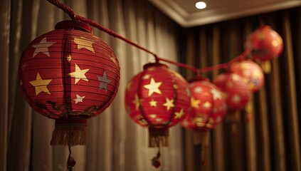 Red paper lanterns, star design, strung on cord