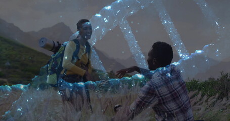 Observing hiking couple with backpacks examining holographic DNA helix in tall grass meadow at dawn