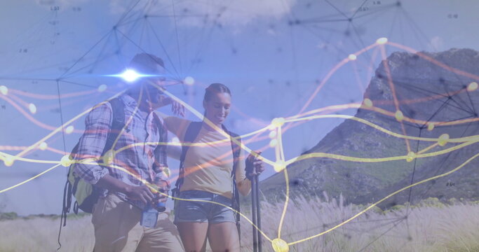 Hikers walking with backpacks, boots, trekking pole, water bottle across grassy plain data overlay