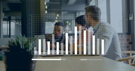 Reviewing team leaning around laptop showing data in office, with succulent and graph overlay