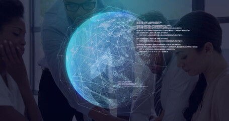 Studying network data business team leaning over conference table in office with holographic globe