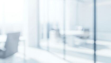 Blurred office interior with glass walls and furniture in a bright setting, reflecting modern transparent design with clean professional workspace and natural light.