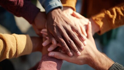 Hands United: A striking image of hands clasped together in a powerful display of solidarity and teamwork, symbolizing unity and collaboration for achieving common goals. - Powered by Adobe
