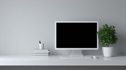 Modern workspace with blank computer monitor, minimalist decor, green plant, and tidy desk setup for creativity and productivity