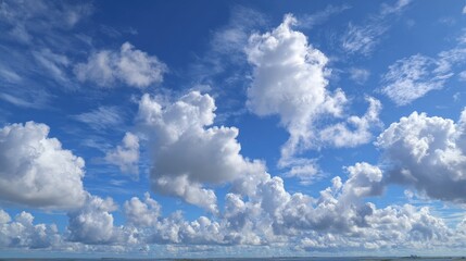 Vast blue sky dotted with fluffy white clouds