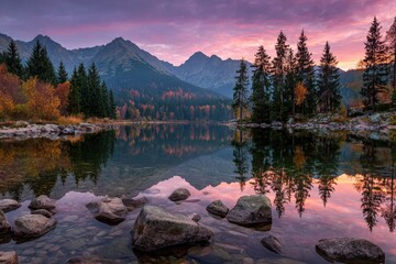 Autumnal mountain lake at dawn. Calm waters reflect vibrant colors