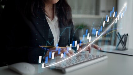 A business professional engages in financial analysis using a computer, with vibrant graphs and...