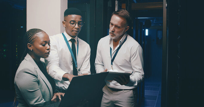 Talking, network and people with tech in server room for cybersecurity, diagnostics and IT support. Team, meeting and workers on laptop, tablet and hardware for system update, database and backup