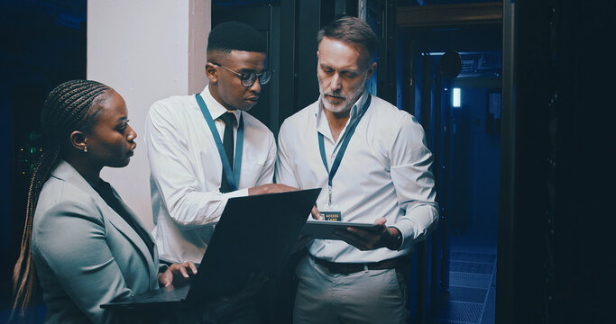 Talking, it support and people with tech in server room for cybersecurity, diagnostics and network. Team, meeting and workers on laptop, tablet and hardware for system update, database and backup
