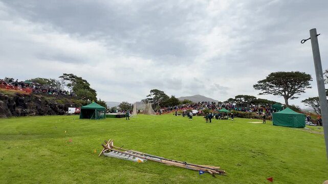 Caber Toss Preparation at Highland Games Arena Outdoors