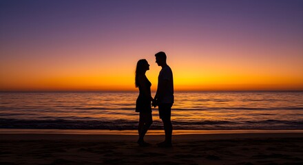 Couple holding hands sunset beach silhouette