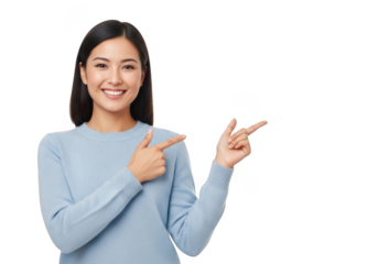 A beautiful young asian woman smiling and pointing to the side with both hands, isolated on a transparent background