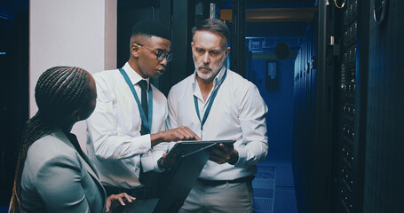 People, programming and tablet in server room, conversation and data center with teamwork. IT...