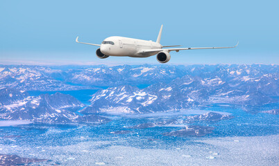 Commercial airplane flying over Arctic landscape - East Greenland