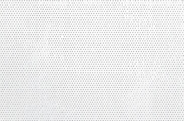Close-up of a white fabric with a repeating grid pattern