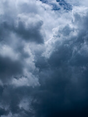 Dramatic dark storm clouds in overcast sky before thunderstorm and heavy rain - moody weather background for climate and meteorology concepts.