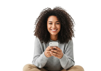 Happy young african american woman with curly black hair smiling while holding a smartphone, isolated on transparent background