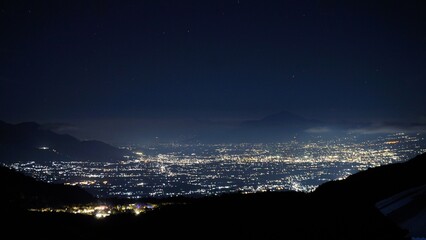 A stunning view of the city lights of Garut at night can be seen from the slopes of Mount...