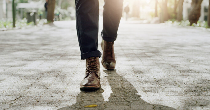 Shoes, businessman and walk on road for travel, morning commute and journey with flare. Outdoor, legs and worker on path at park with pedestrian, corporate professional and trip with steps in city