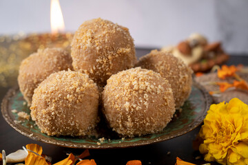 Ladoo or laddu wheat flour laddu made using ghee and jaggery or sugar