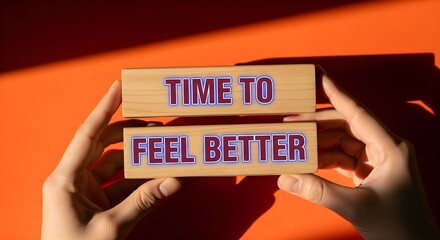 Hands present 'time to feel better' on marble blocks, offering a message of positivity and well-being.