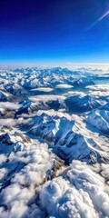 Panoramic view of snow-capped mountains against a blue sky with fluffy white clouds
