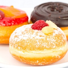 Close-up of three assorted donuts