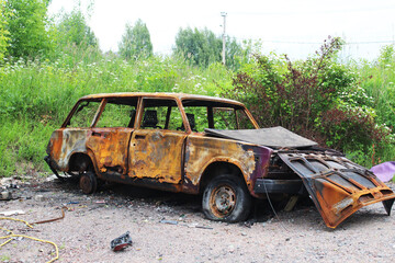 An old abandoned machine. Car after fire