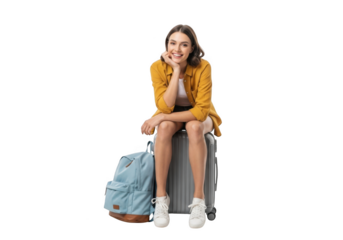 Young woman traveler with suitcase and backpack sitting and smiling, isolated on transparent background