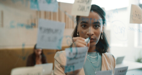 Portrait, business woman and glass for planning, ideas or schedule for project management in...